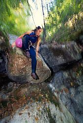 JennyJump - Jenny jumping over a tree stump while going down a canyon, central Italy