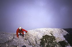 JennyRedBlue - Red Jenny climbing in the fog, Corno Piccolo, Gran Sasso, Central Italy