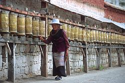 PrayerDrums - Old woman rolling prayer drums, Tibet, 2000
[ Click to download the free wallpaper version of this image ]
