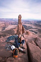 WasherWomanSummit - Jenny on the summit of Washer Woman, with Monster Tower and the White Rim in the background. Moab, Utah, 2003
[ Click to go to the page where that image comes from ]