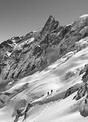 20060406_0011045_MeijeBW - One of the major summit of the southern Alps, La Meije looms above skiers of the small town of La Grave, Oisans.