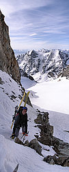 20060515_0011533_CouloirBrecheGlacierNoirPano - The upper part of the gully becomes rocky but is skiable earlier in the season (50° slope), Oisans.
[ Click to go to the page where that image comes from ]