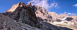 20060906-1833-MeijePromontoirePano_ - The impressive south face of La Meije, with the Promontoire Hut on the outcrop dominating the middle of the image. Even though it's september and quite late in the season, there's still water running down the south face. The west face is on the left.
[ Click to go to the page where that image comes from ]