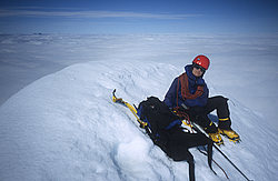 MtAspiringSummit - Taking a break after reaching the summit of Mt Aspiring, above a sea of clouds, NZ.
[ Click to download the free wallpaper version of this image ]