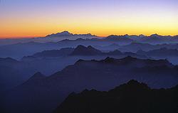 MultipleSummitsDark - Multiple summits ridges seen at dusk, Alps.
[ Click to download the free wallpaper version of this image ]