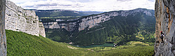 20070616-ChoranchePano_ - Panoramic view from halfway up one of the climbing routes of Presles, with the Choranche lake and the other side of the valley across the cliff. The famous Choranche cave is hidden at the base of the left wall. The highest ridge of the Vercors (the Grand Veymont) is visible in the background.
[ Click to go to the page where that image comes from ]