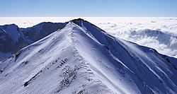 20080217_132215_VallonPierraPano_ - Tete de Vallon Pierra, with skiiers on its sumit.
[ Click to download the free wallpaper version of this image ]