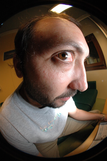 [20050606_FisheyeChristophe2.jpg]
Another fisheye portrait, with an even more dramatic angle. The main difficulty is lighting as usually one side is darker than the other. This time the picture is taken from a digital camera (Nikon D70), notice how the image circle covers the full height of the frame bu only about half of the width.