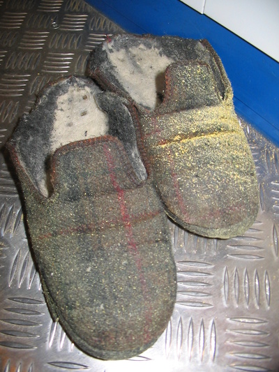 [20051019_031_RottenSlippers.jpg]
The slippers of one member of the technical team, after a winter of abuse welding, painting, sawing off metal...