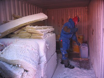 [CleaningContainer.jpg]
Pascal sweeping the snow accumulated by the storm off a storage container.