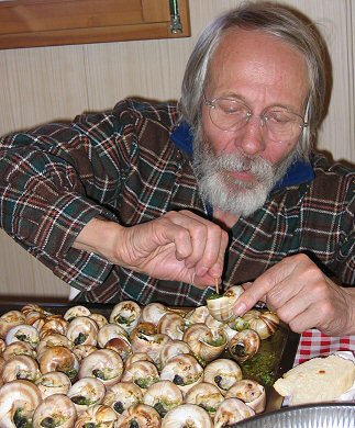 [FavreSnails.jpg]
Jean Paul Fave, construction manager of Concordia, in good company with a tray of snails.