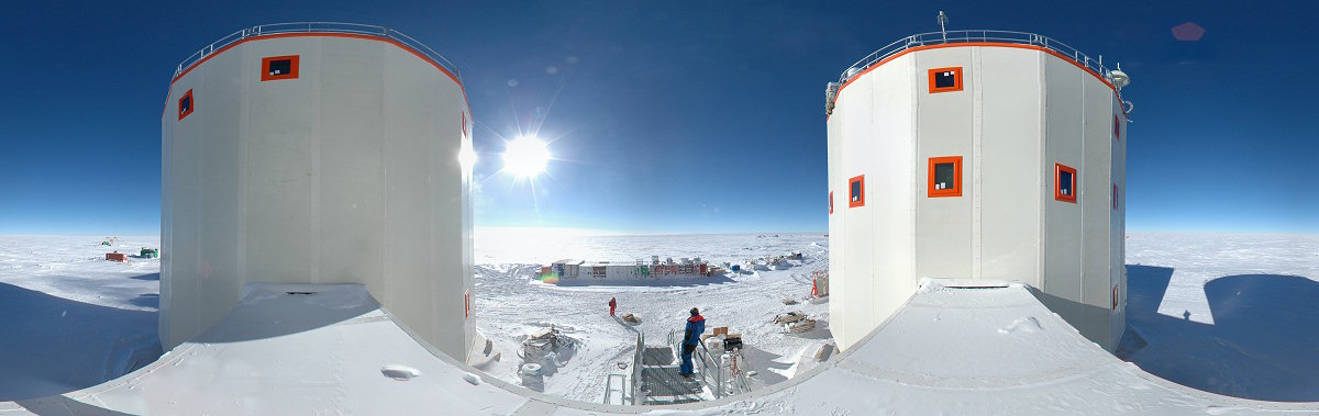 [PanoTunnel.jpg]
Panorama taken from the roof of the tunnel linking the first floors of both buildings (noisy on left, quiet on right). Michel is right on the stairs below after having helped me climb on the slippery tunnel and Emanuele is on the plaza, just coming back from storing his snow samples in the container on the left. Notice all the stickers still on the windows, like the average construction site, except that with the cold it now impossible to remove them.