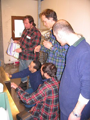 [RepairDishwasher.jpg]
Everybody gathered around the new dishwasher to try to fix it: Michel, Pascal and Emanuele (standing), Karim and Christophe (kneeling).