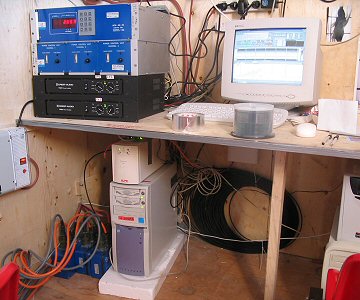 [SodarAcquisition.jpg]
The Sodar acquisition system inside the container: the electronics and amplifier (blue and black boxes), the PC (on the ground) and the old monitor. On the floor the blue boxes are the preamplifiers connected directly to the antennas.