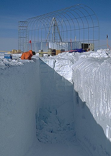 [GlacioOut.jpg]
A glaciologist taking snow samples. This big hole was done as an attempt to recover the drill when it got stuck for a few days. Fortunately it was not needed. In the background the drilling 'tent' is visible before its completion.