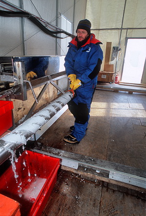 [IceCoreExtraction.jpg]
Extracting the screw containing the ice core from the drill casing. Chips soaked in drill fluid are falling off.