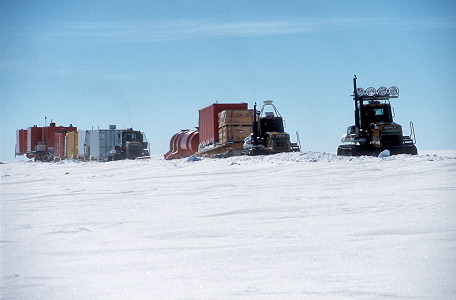 [SledTrainArriving1.jpg]
Vehicles on the last leg of their long journey before reaching Dome C. They are partly hidden by the wall of snow built on the side of the track. The two 'energy' and 'living' modules can be seen towards the end.