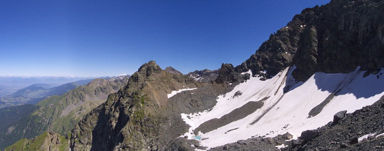 [20080724_115340_PetiteLanceDomenePano_.jpg]
Petite Lance de Domene seen from the Sitre glacier which I used as a descent. A shitty descent: it's an unstable pile of mid-size blocks which roll over as soon as you step on them.