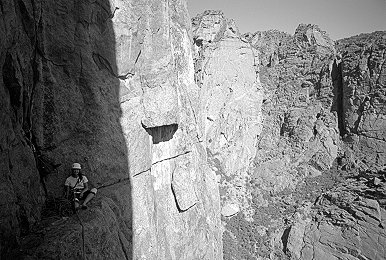 [SC_BivyLedge.jpg]
Resting in the shade of the bivy ledge of the seventh pitch. Exactly halfway up.