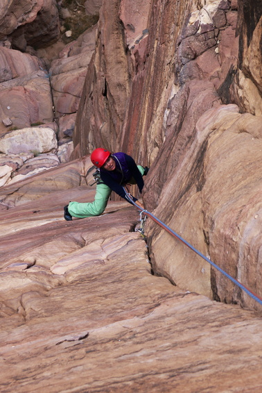 [20111115_081818_CatfishCorner.jpg]
Jenny on the 2nd pitch of Catfish corner, and incredibly beautiful finger crack which protects very well with a wide variety of gear, but that won't offer any respite in term of rests. I had to rest on it while she onsighted it. Although graded easier at 6a+, the 1st pitch is somewhat worse: a kind of offwidth in a dihedral with two fingercracks about a hand's distance inside. You never know what position to adopt: chicken wings for the offwidths ? Inconvenient finger locks for the deeper cracks ? Layback for the dihedral ? It's usually some awkward and inefficient combination of all 3. At least the 2nd pitch is straightforward and doesn't require you to think.