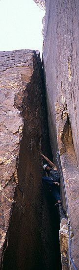 [EpinephrineChimney2.jpg]
Me stepping on the last foothold of the 4th pitch in a row of 5.9 chimney up Epinephrine