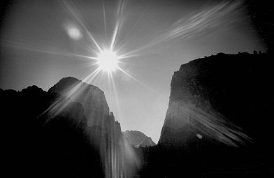 [BW_AngelLandingBacklit.jpg]
Angels Landing (right) and the Great White Throne (left) backlit. The North-East buttress follows the left edge visible on the picture.