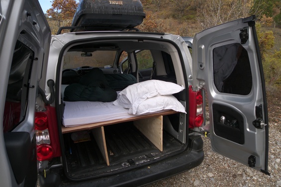 [20091108_103933_PeugeotPartner.jpg]
A view of the back of the car with the bed unfolded, the mattress on top.
