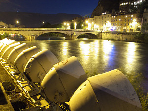 Heavy projectors lighting up the fortress above the city of Grenoble