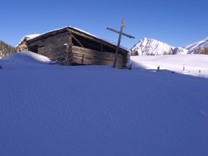 Snow covered mountain hut