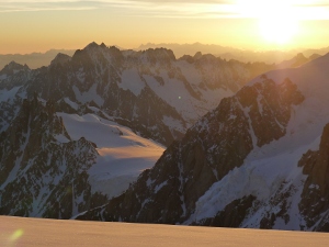 Sunrise on Aiguille du Midi as seen from near the summit of Mt Blanc