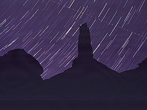 Castleton tower at night with stars and satellite