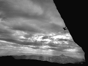 Trying to figure out the next move up the large overhanging wall of Ceuse