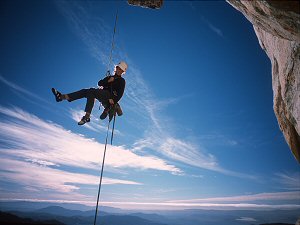 Jenny rappelling a roof at Tahquiz