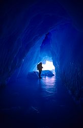 IceCave - Person standing in an ice cave within an iceberg, Antarctica
[ Click to download the free wallpaper version of this image ]