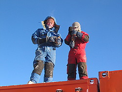 20050408_01_TopFuelContainer - Two polar people on top of a container.