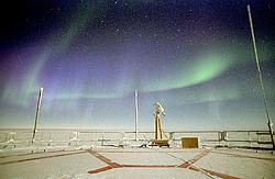 AuroraRoofLow04 - Green and purple aurora in the Antarctic night.