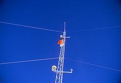 CR23MastTopBlueSky - Cleaning sensors on an atmosphere science mast, pure blue sky.
