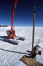 RodriguezWell-LoweringTube2 - Lowering a casing tube into a drilled snow hole.
[ Click to go to the page where that image comes from ]