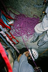 SalatheSleeping - Jenny sleeping hanging by my feet while we wait for the previous party to finish the pitch. Salathé Wall, El Capitan, Yosemite, California, 2003
[ Click to go to the page where that image comes from ]