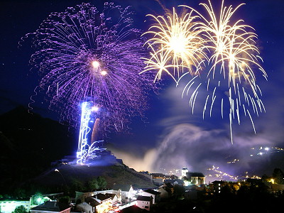 [20060714-Fireworks.jpg]
Combined image of fireworks above the old city center of Briançon, 14 July 2006. As you can see on the work images, I didn't even bother aligning the images. Quite the opposite, I selected pieces I liked off various images and stacked them with Photoshop in the places I liked, removing the parts I did not want. A process made easy here by the dark background. The layer stacking is performed mostly using the 'Lighten' or 'Overlay' options so you don't even have to worry about the background being cut improperly. I took a special background image with a longer exposure time so I could have a clean background.